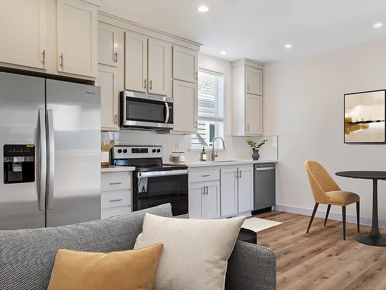 Freestanding Home kitchen and dining room with hard surface flooring