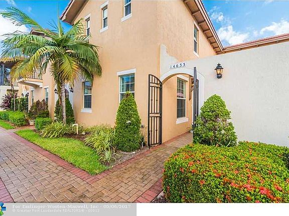 Impressive Mediterranean Inspired Town Home In Highly Desired West Pembroke Pines Gated Community.