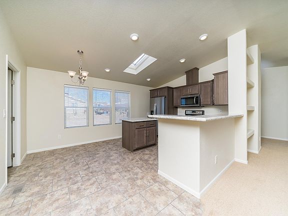 Dining Area - Very open & bright.  Upgraded trim thru-out, chandelier light.