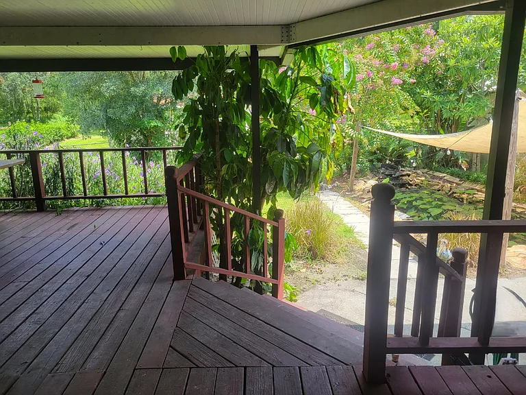 Large 20 x 20 covered patio that over looks 1.3 acres of land with fully stocked Koi Pond and fenced yard that backs up to the woods.