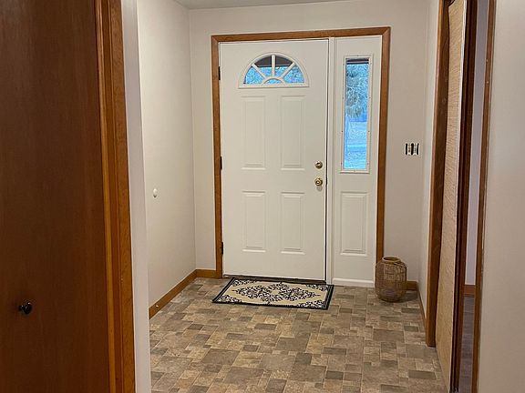 This open entry is large enough for greeting guests and provides a large coat closet for additional storage.