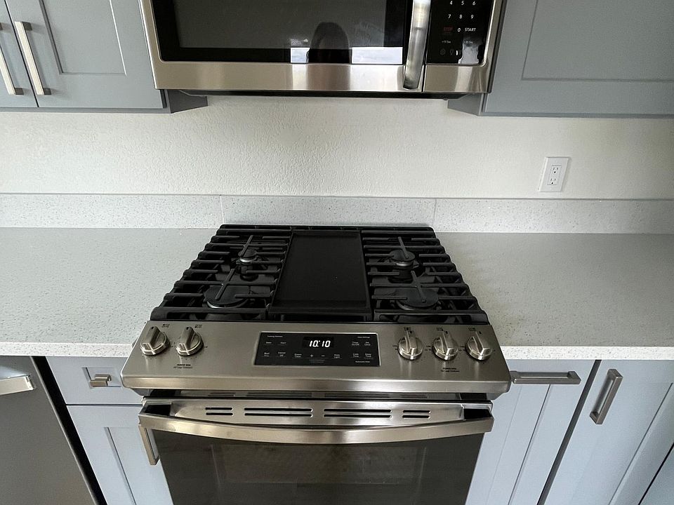 New gas stove with griddle; microwave
