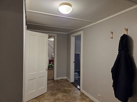 Entry hall - bedroom on right, bath on left, kitchen ahead, living room behind to right