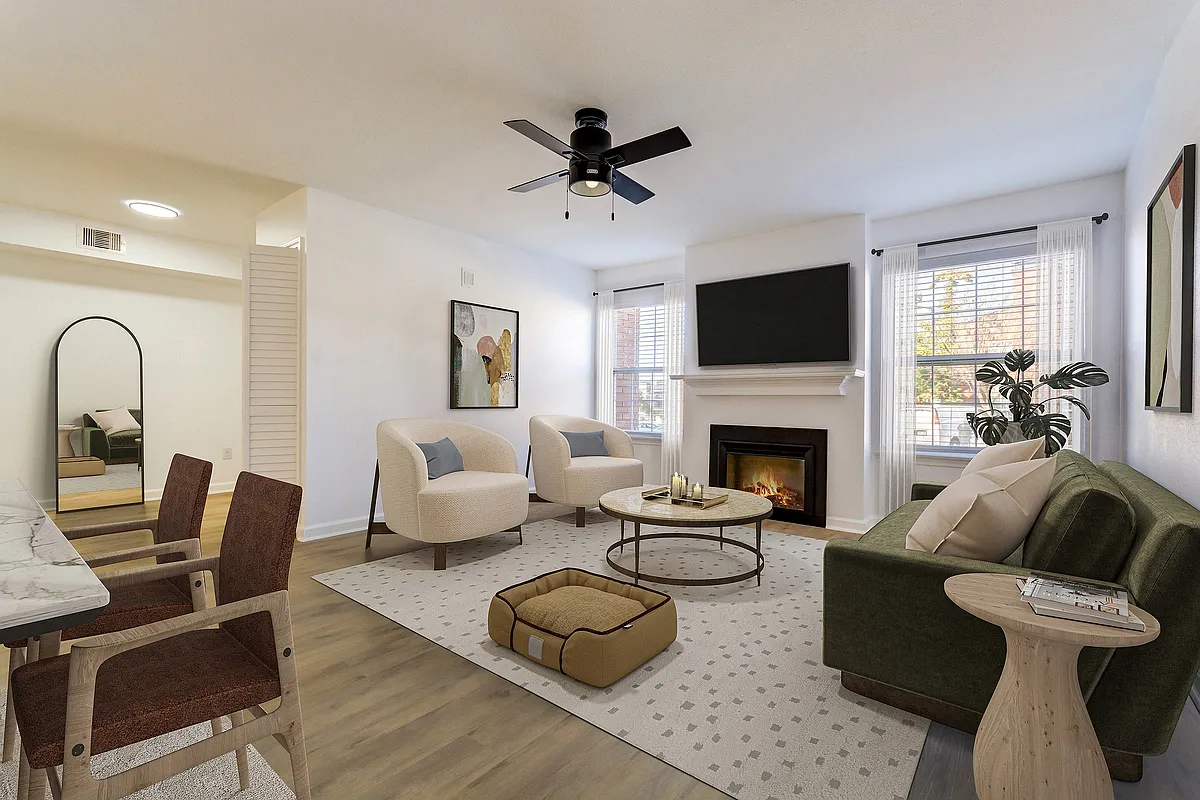 A spacious living area with cozy fireplace is shown at ReNew on Cantrell, featuring modern furniture and decor. - ReNew on Cantrell