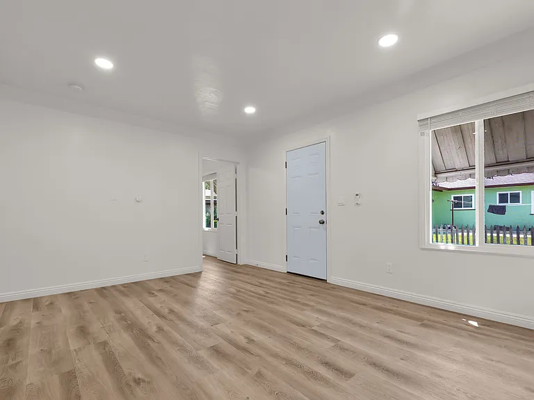 Living room, peeking into the second bedroom
