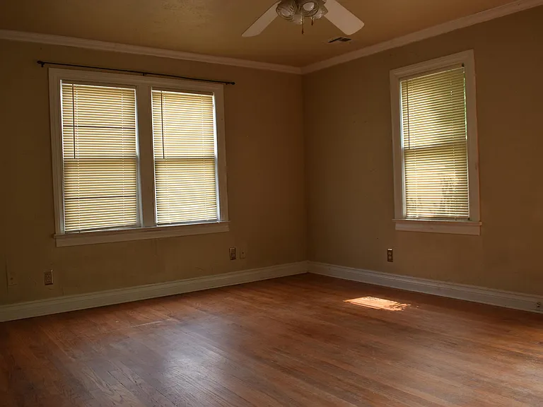 Natural Lighting with lots of windows. Original red oak wood floors!