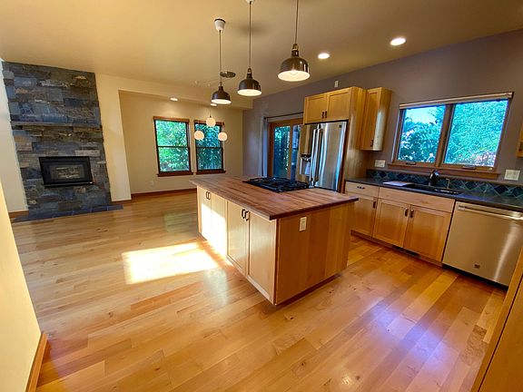 Kitchen with gas stovetop, large fridge, and tons of storage