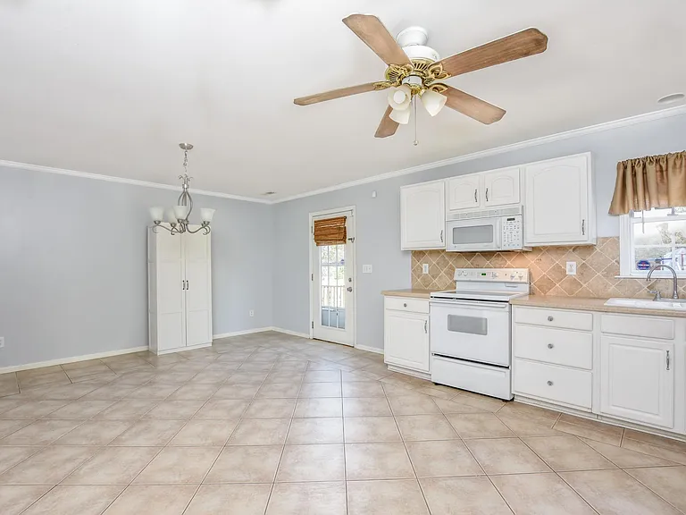 Kitchen and dining area. Lots of natural light.