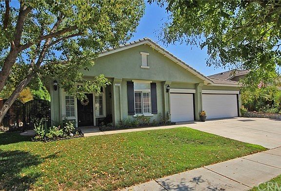 Front lawn with mature shade tree