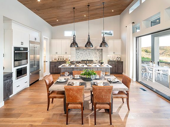 Open concept floor plan with casual dining area adjacent to kitchen
