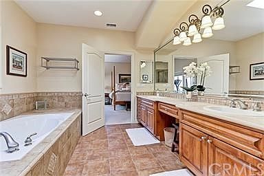 Luxurious Master Bath with spa tub and double sinks.