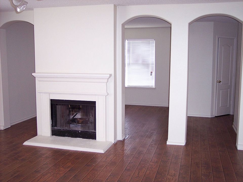 living room, fireplace, arched entry to dining room