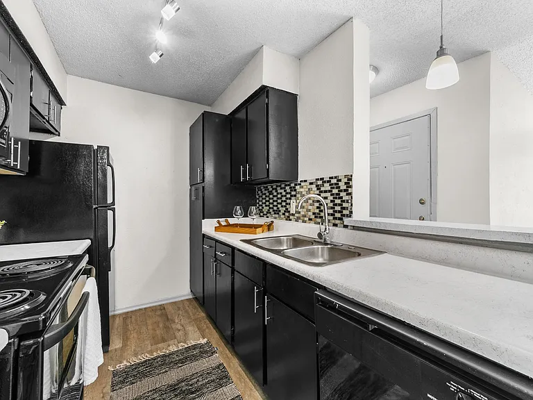 B1 Kitchen w/ Black Appliance Package & Tile Backsplash