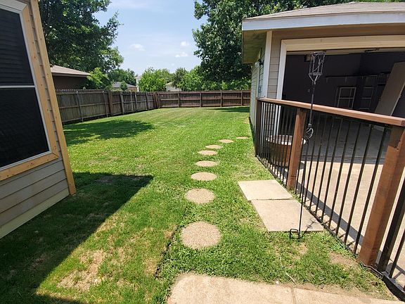 Backyard viewed from rear entrance (photos taken before home repainted)