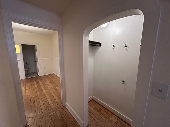 Coat closet with hooks & dining room