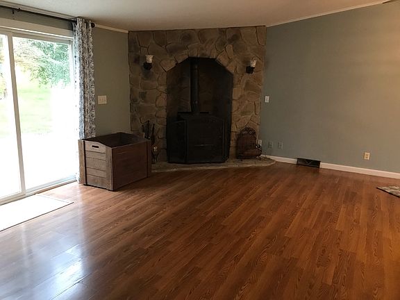 Living Room with Wood Burning Fireplace