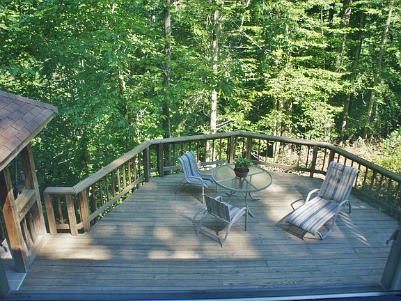 main level BR window overlooks deck