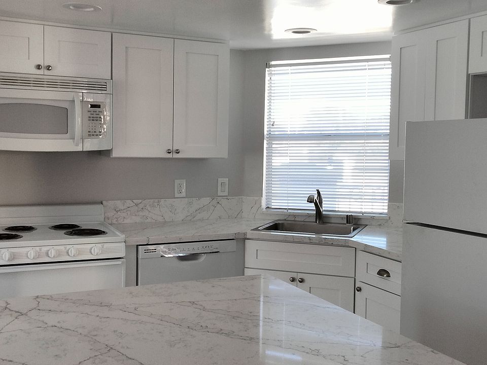 Gorgeous new kitchen with dishwasher, central island and ample work-space for preparing meals and entertaining.