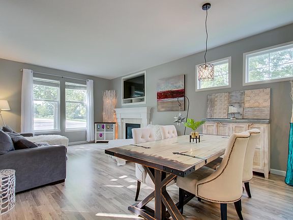 Open, bright living and dining area with 9 ft ceilings