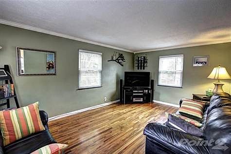 Check out the gleaming hardwood flooring! Other great features of this room include crown molding th