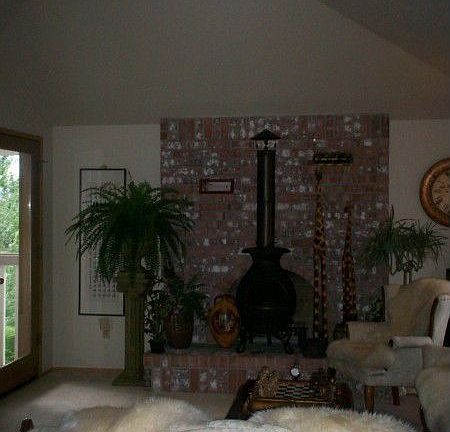 Cozy family room has fire place and own deck.