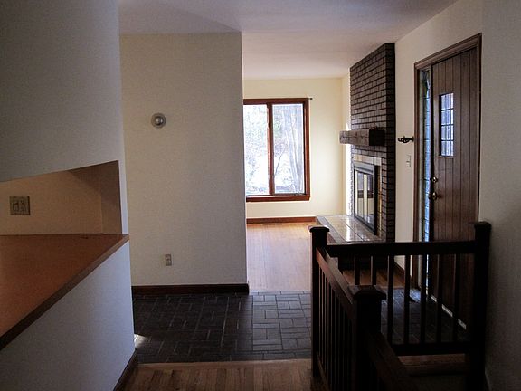 View from living room down the hallway toward bedrooms and bathroom