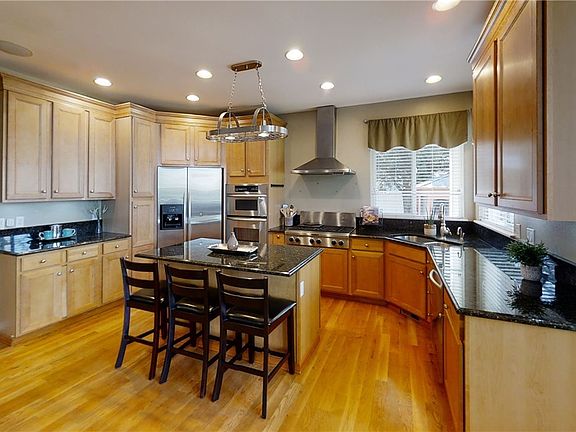 Gourmet Kitchen with Granite, Stainless Steel, Butler's Pantry and Walk-In Pantry.  Have Morning Coffee at the Center Island or in the Eating Nook.