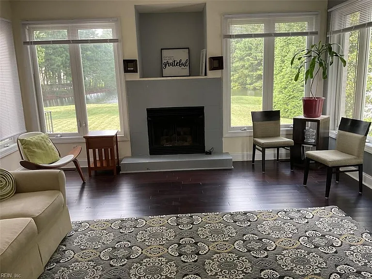 Enter the large Familyroom with gas fireplace and backyard views