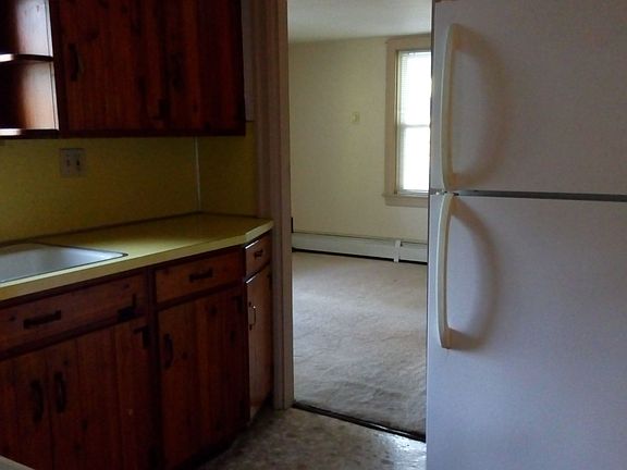 Kitchen leading to main bedroom