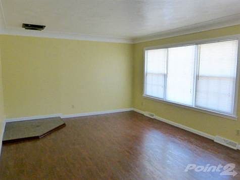 Living Room with cove ceiling and laminate flooring
