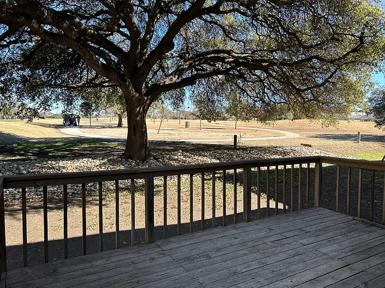 Image BBQing and relaxing with friends while watching folks golf. Oh do not worry the tee is on the other side and you do not have to worry about golf balls coming into the yard or landing on your deck.