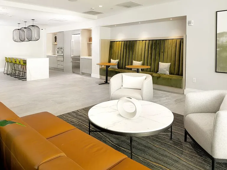 Resident lounge with seating area and kitchenette