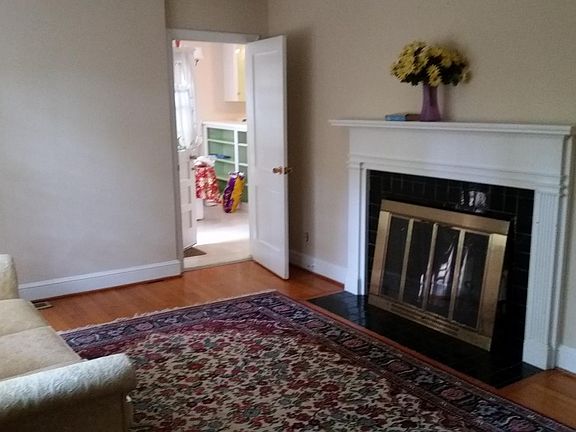 Living room with hardwood floor. There really 2 living spaces with a shared kitchen_great for roommates to have their own suite. Front suite has living room,2 beds and 1 bath