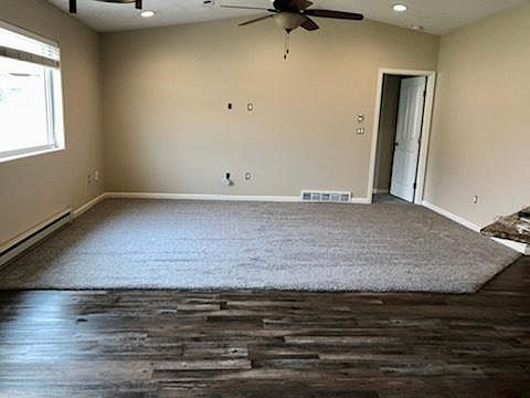Newer luxury vinyl flooring throughout kitchen, entry 2nd bath and laundryroom. Newer carpet in livingroom and master bedroom.