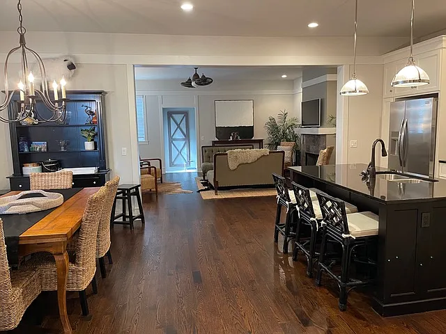 1st Floor: Open floor plan with kitchen dining and living room leading to oversized mudroom, powder room and garage.