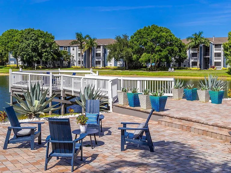 Gather with neighbors on our inviting waterfront patio and dock, complete with comfortable seating and lush lake views.