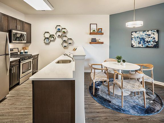 Gorgeous Quartz Counters and Gleaming Stainless Appliances