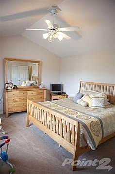 Oversized master suite offers vaulted ceilings, his and hers closets, and a master bathroom not typically found in this price range!