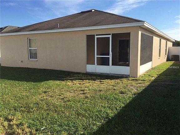 Patio and fenced backyard