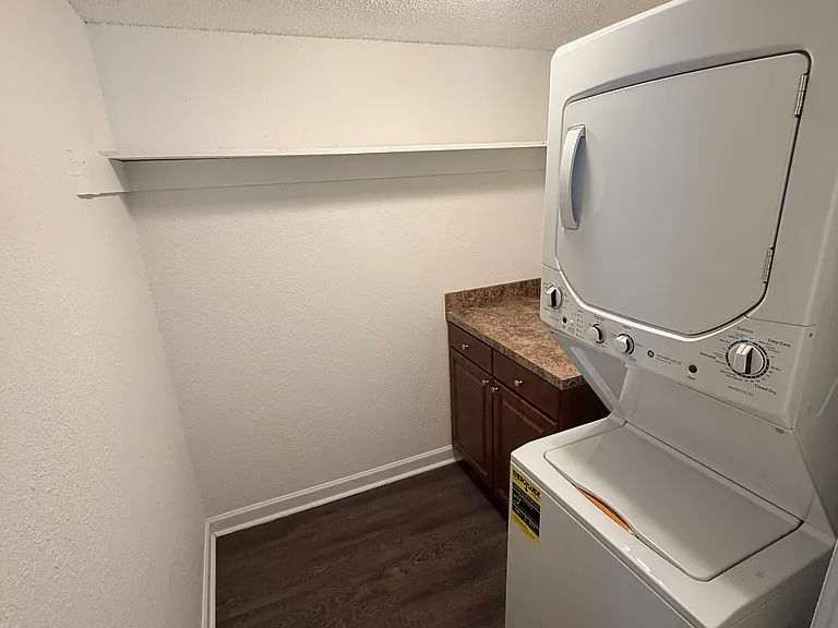 One Bedroom Laundry Room W/ Linen Folding Table