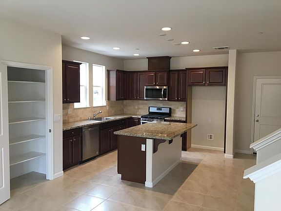 Kitchen (lovely granite/backsplash) before arrival of Fridge