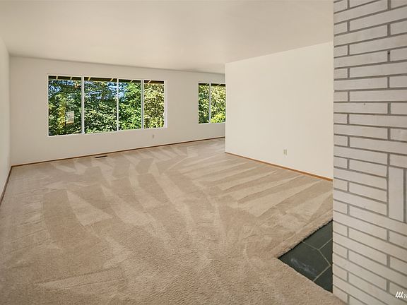 Spacious living room opens to the formal dining room for easy flow when entertaining. >