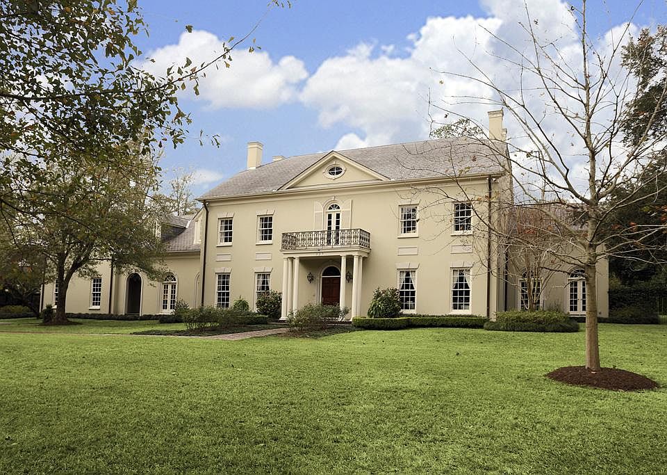 Stunning classic Georgian estate, a one owner home designed by Jon Gilbreath, situated on a beautiful wooded acre lot in the close-in Memorial subdivision of Sherwood Forest.