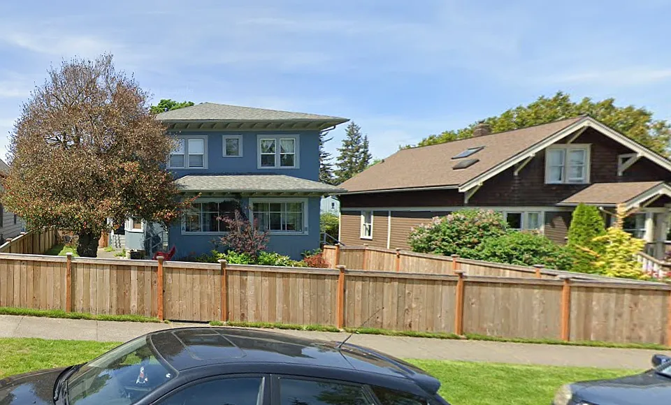 Front of house, unit A is on the left, inside the fence. Fully fenced yard and covered porch on front and back
