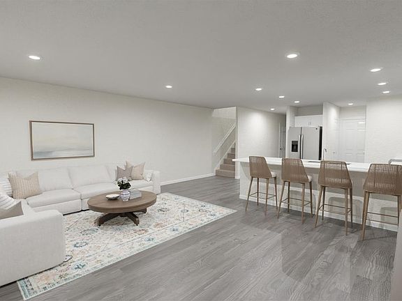 Enjoy a bright and open living area - Azalea townhome by Highland Homes Artist s rendering