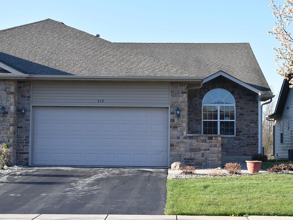 Front with two car attached garage