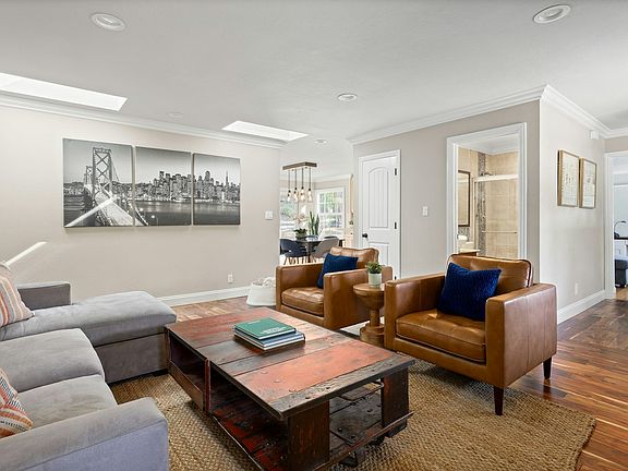 Bright spacious living room with skylights