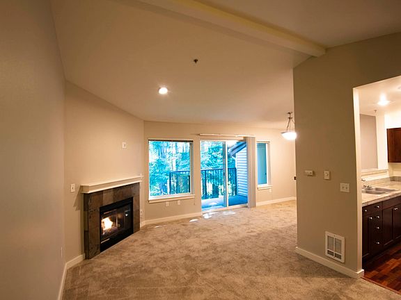 View of the living room and kitchen entry from the front entry.