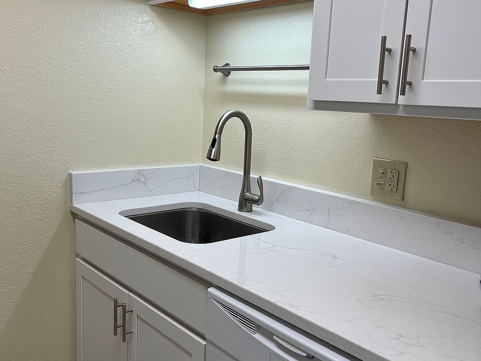 Kitchen view of new kitchen with dishwasher and disposal.