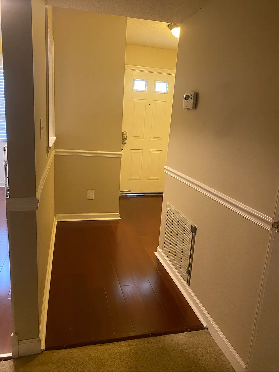 Entry foyer (looking from living area toward front door). - 132 Schultz St